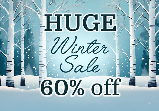 Winter sale advertisement with snowy trees and 'HUGE Winter Sale 60% off' text.