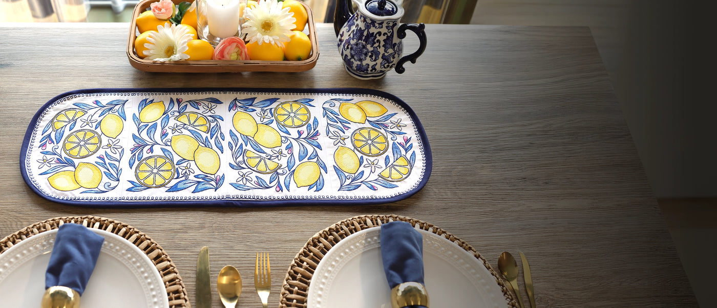 decorative machine embroidery lemon table runner design on a wooden table setting