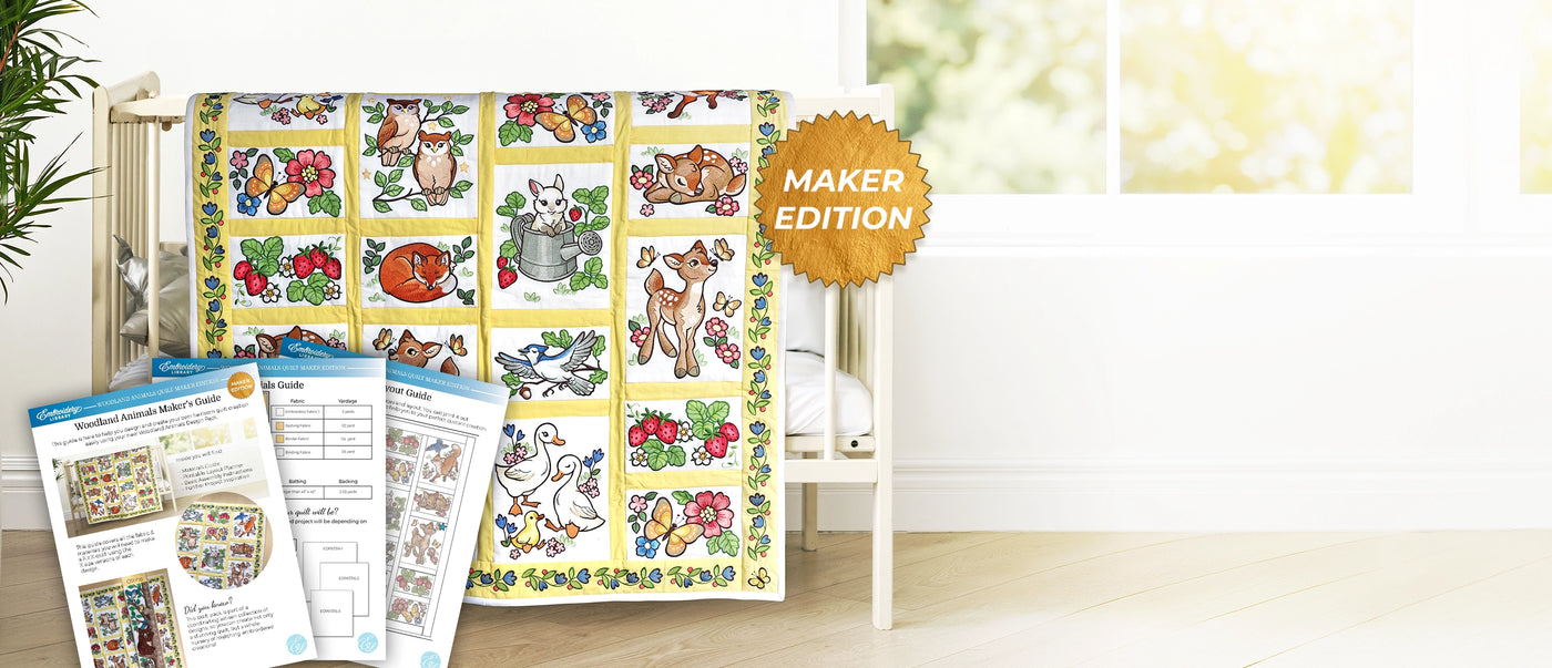 Machine embroidered children's quilt with woodland animal patterns staged on a crib with a Maker Edition label