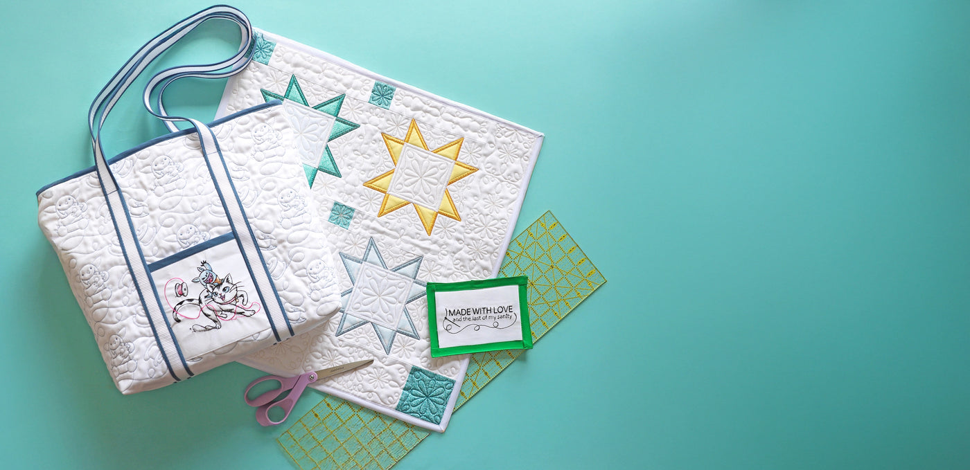 Machine embroidery edge-to-edge Bobblin™ design, quilted star and quilt label on teal background.