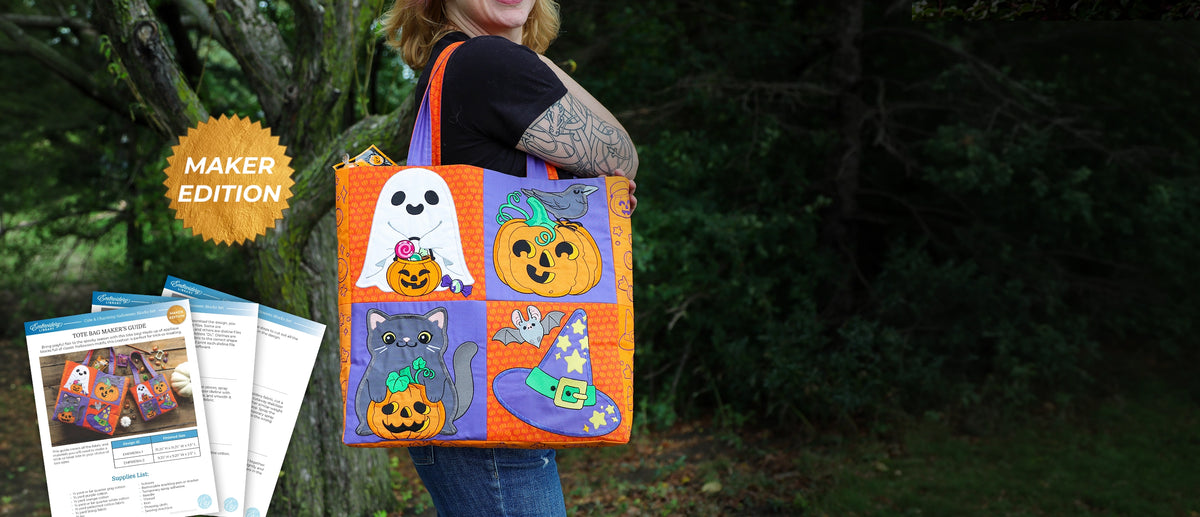 Woman carrying a colorful machine embroidered Halloween tote featuring embroidered ghost, pumpkin, black cat, and witch hat designs, shown with a Maker Edition badge and Maker’s Guide.