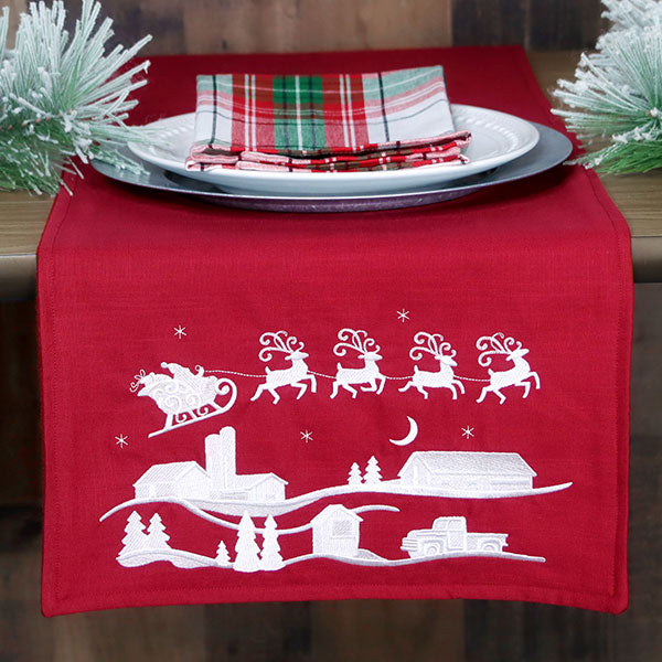 Santa's Flight Over a Snowy Village Scene (Whitework)