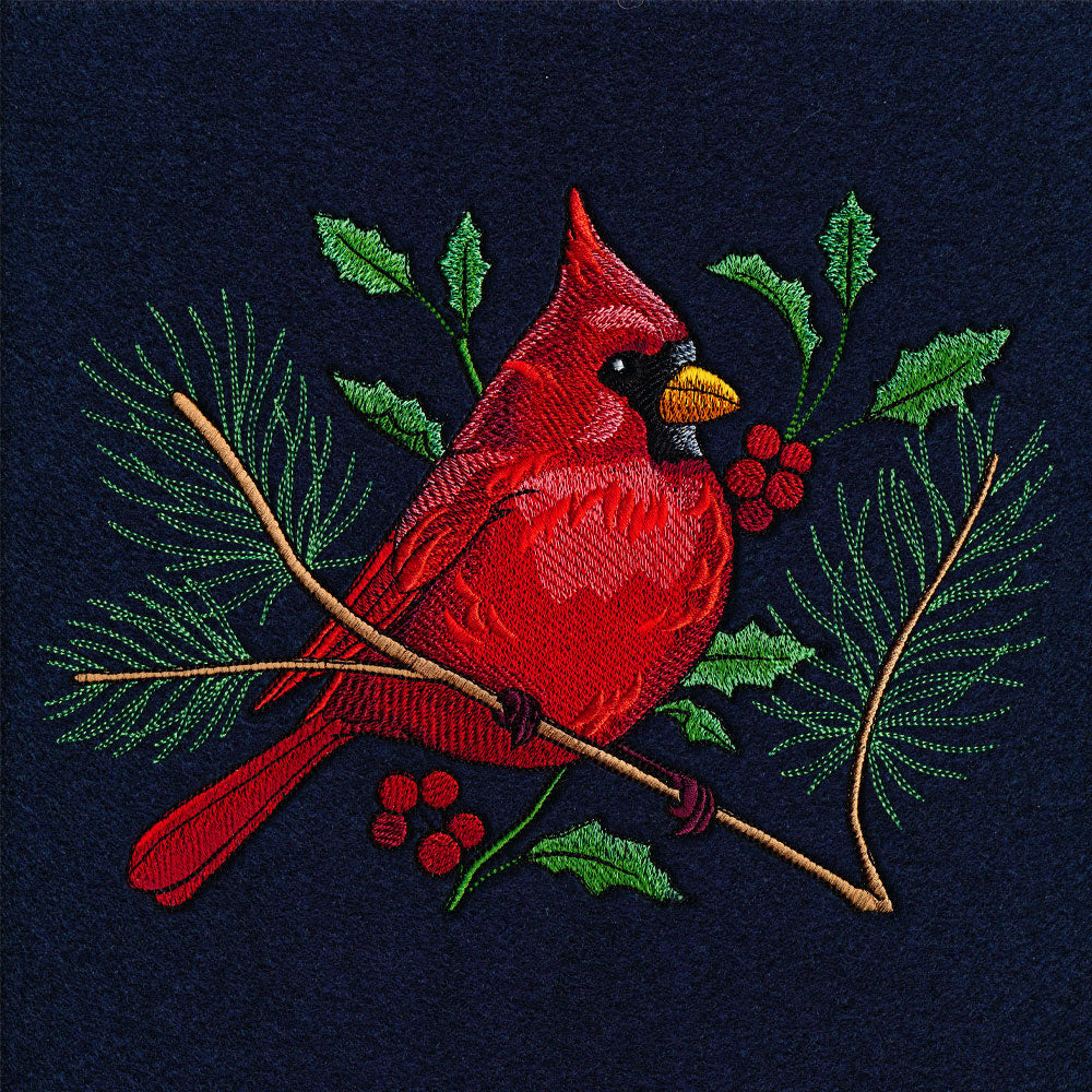 Digitally downloadable machine embroidery design of a red cardinal perched on a branch with berries and green leaves.