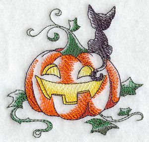 A Halloween Kitten with Jack-o-Lantern