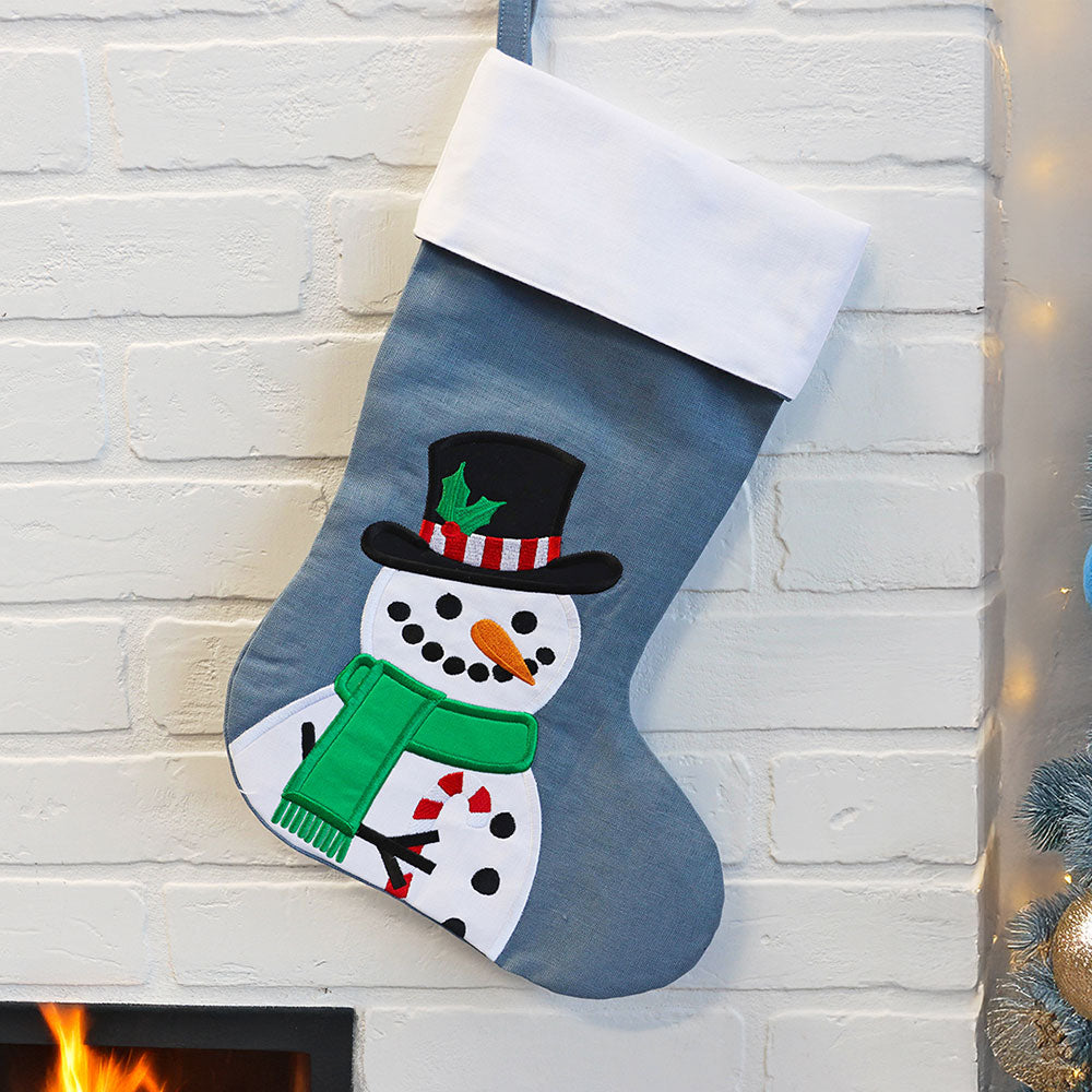 Christmas stocking made with a machine embroidery design of an applique snowman