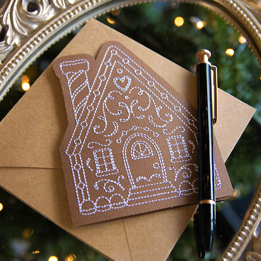 Machine embroidered cardstock greeting cards - one on blue cardstock with snowflakes and phrase Season Greetings - one on white cardstock with bells and phrase Joy - one on white cardstock with reindeer with phrase Merry Christmas