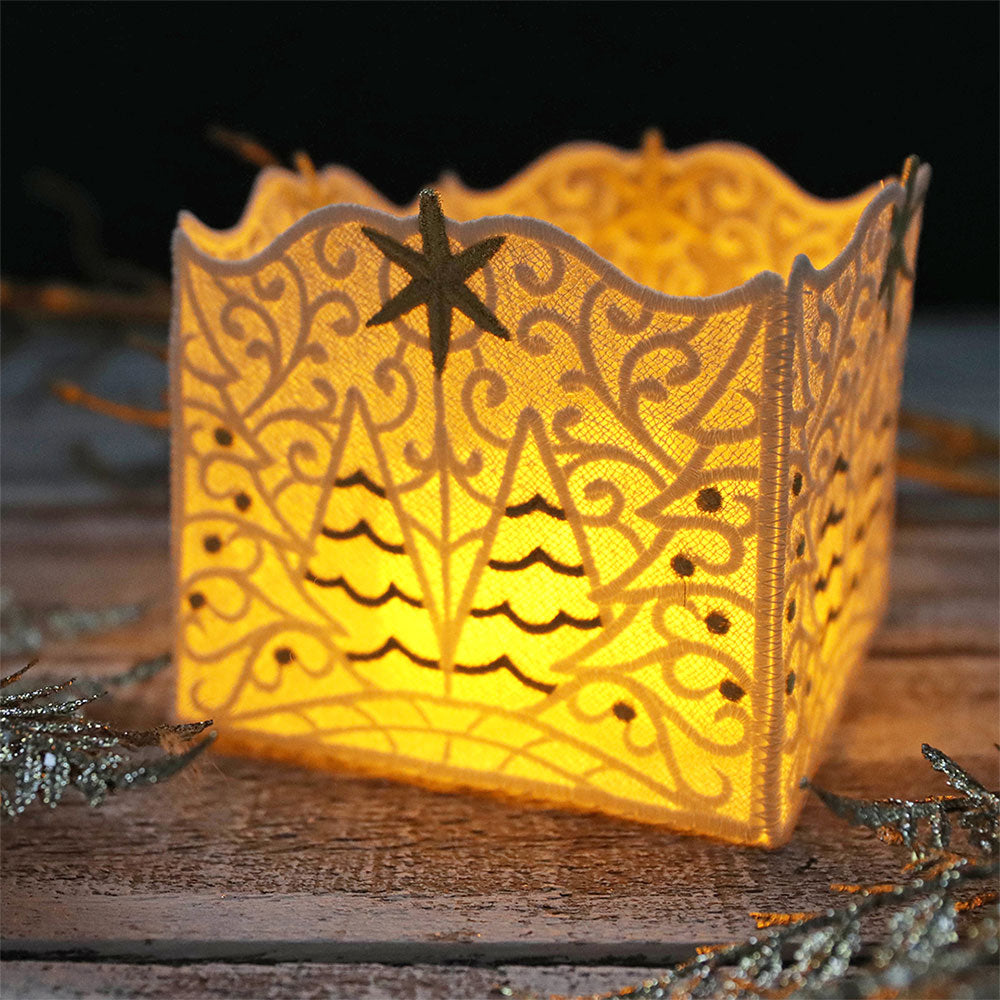 machine embroidered lace lantern with winter details