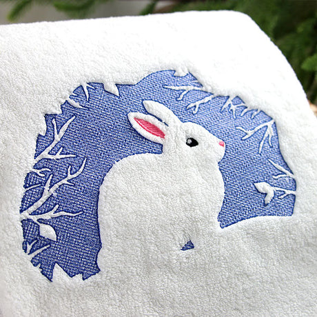 embossed bunny machine embroidery design on white terrycloth towel