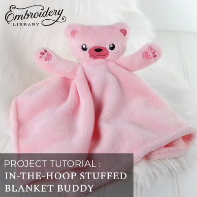 machine embroidery design of a blanket buddy bear