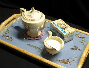 Completed embroidered tray with tea service