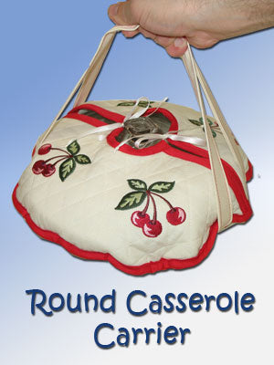 Hand holding the completed Embroidered Casserole Hot Dish Carrier featuring Cherry Bunch design