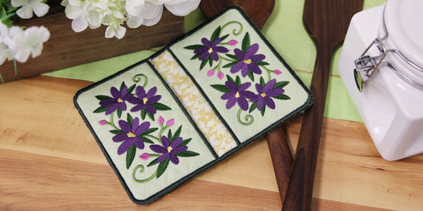 Finished pot holders with embroidered crocus design