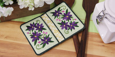 Finished pot holders with embroidered crocus design