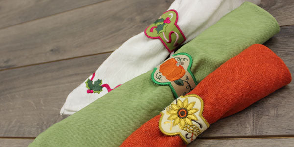 Completed napkin rings featuring  Merry Christmas Holly and Shades of Fall designs
