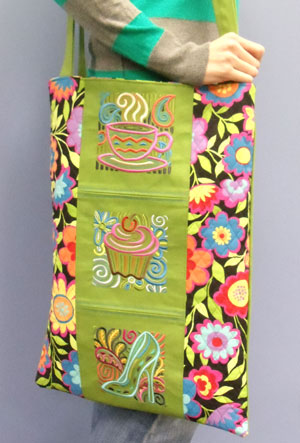 Completed Favorite Things Embroidered Tote, featuring Mola Cuppa Joe Square, Mola Cupcake Square, and Mola Diva Shoe Square designs