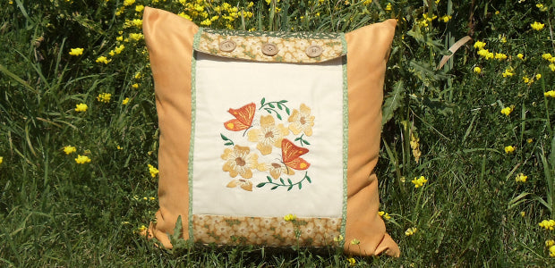 Completed Embroidered Pillow Wrap project, featuring Butterflies in Blooms design