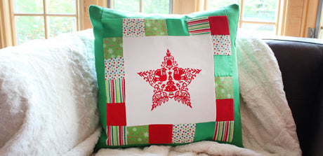 patchwork pillow showing a star machine embroidery design
