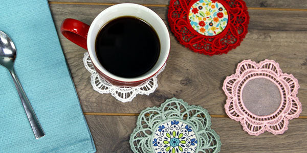 A table place setting with coffee mug and lace doilies