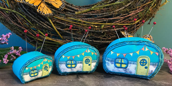 Completed pincushion project in three sizes, featuring Camper design