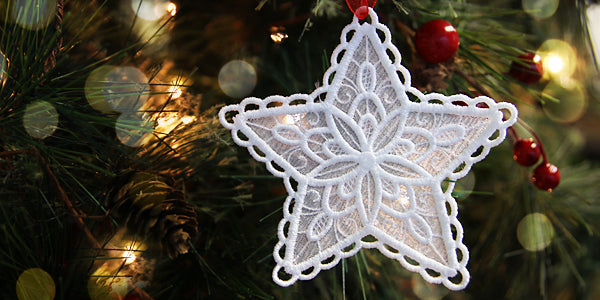 Completed lace edge ornament hanging on Christmas tree