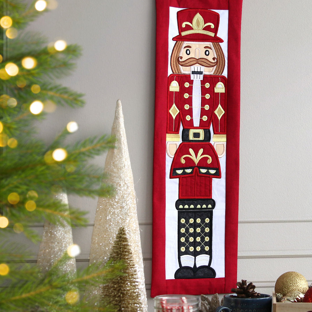 machine embroidered panel scene featuring a Christmas nutcracker