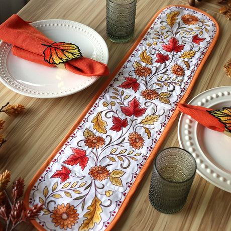 multi-piece machine embroidered table runner featuring fall leaves