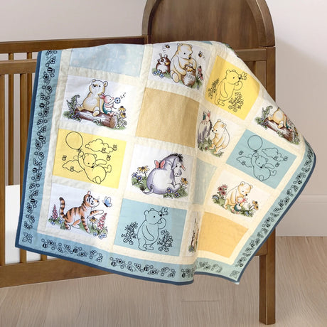 machine embroidery designs of Pooh Bear & Friends on a baby quilt