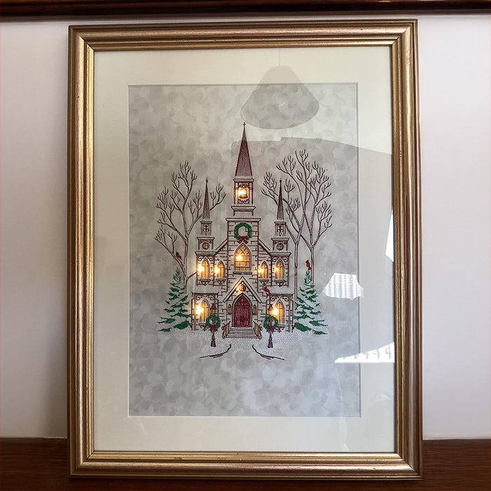 Framed machine embroidered Christmas church scene with lights