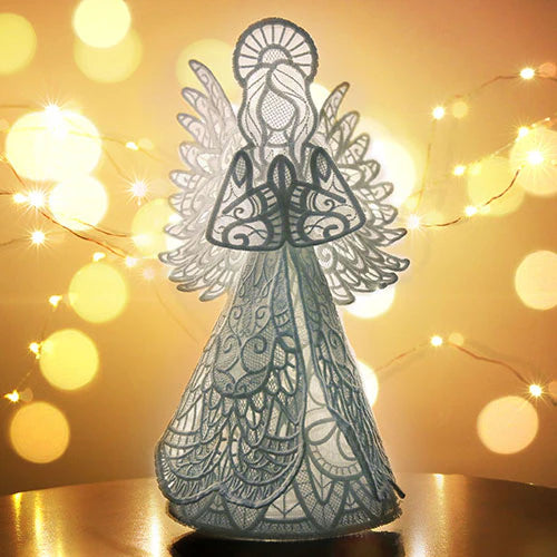 Machine embroidered 3D lace angel design against a warm, blurred light background