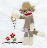 Sock Monkey Plants a Garden