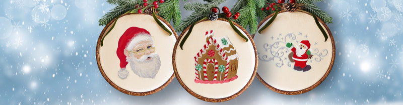 Three hooped machine embroidery designs featuring Santa Claus, a gingerbread house, and another Santa figure on a snowy background.
