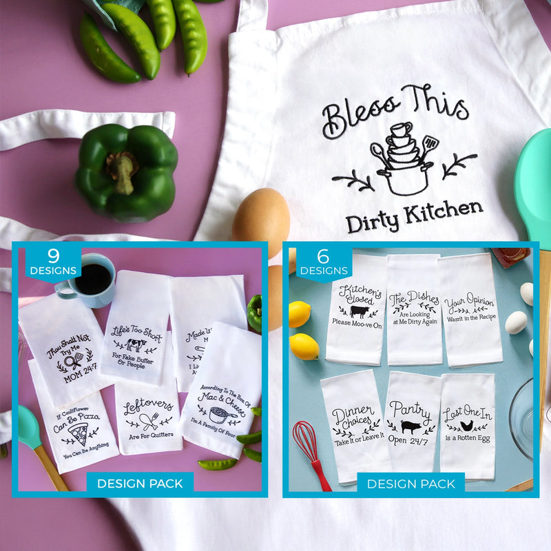 Kitchen-themed aprons and tea towels with humorous machine embroidery sayings on a table with vegetables and kitchen items.