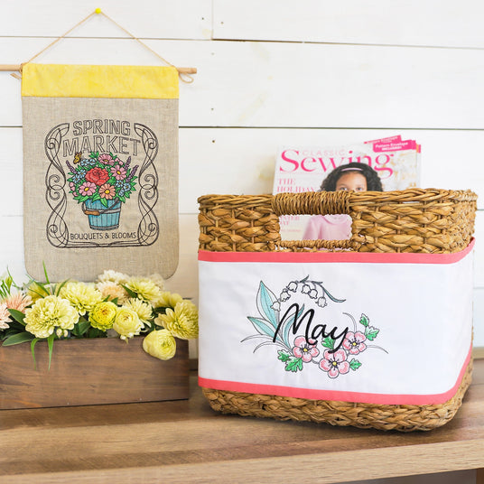 Machine embroidery Spring Market sign on banner and May design on basket.