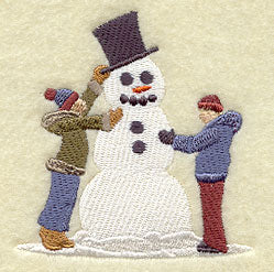 Christmas Villagers Build a Snowman