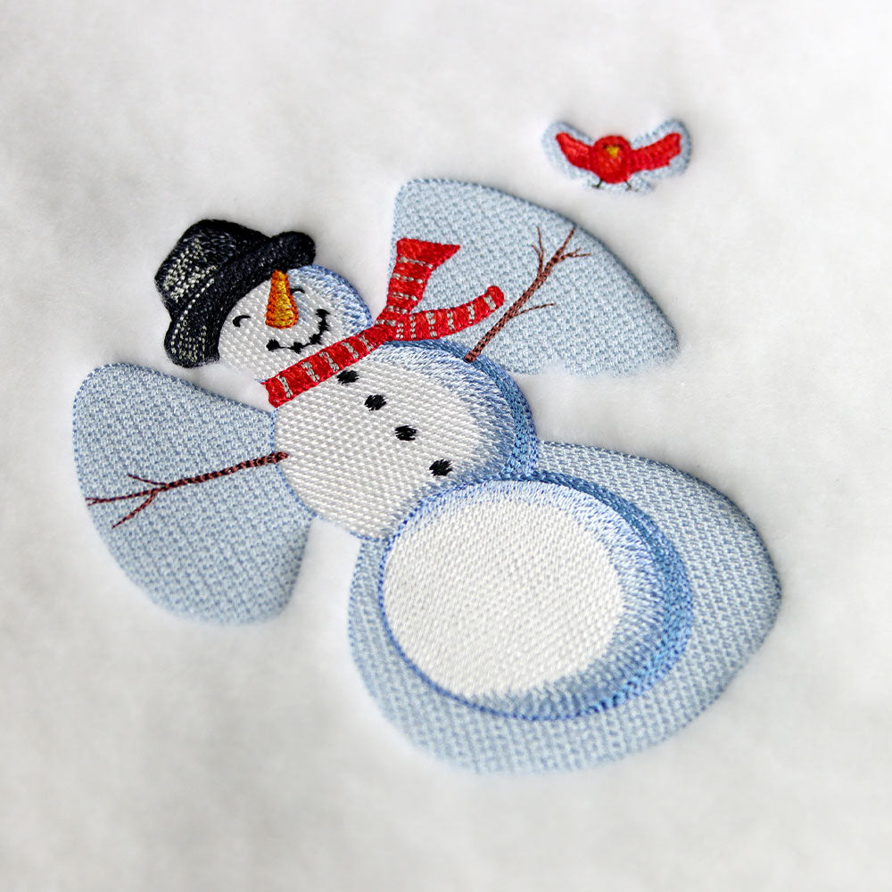 Digitally downloadable machine embroidery design of a snowman with a black hat, red scarf, stick arms, and a small red bird above its wing.