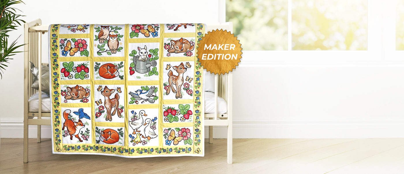 Machine embroider woodland animals on a quilt hanging over a crib.