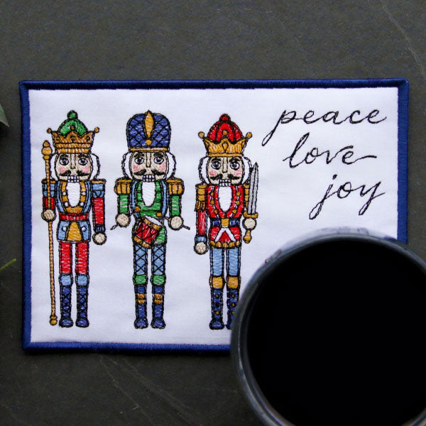 Season's Greetings Nutcracker Mug Rug (In-the-Hoop)