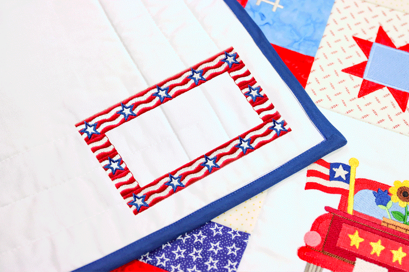 Machine embroidered patriotic quilt label on the corner of a quilt.