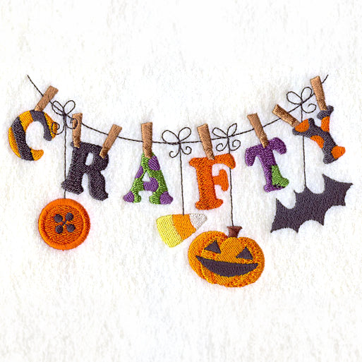 Embroidered letters spelling “CRAFTY” and Halloween motifs arranged on a line; digitally downloadable embroidery design.