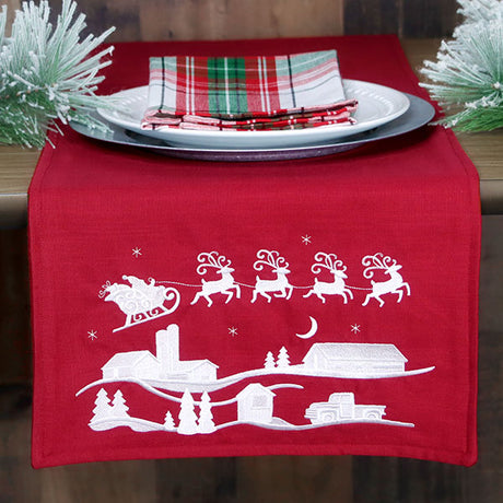 Santa's Flight Over a Snowy Village Scene (Whitework)