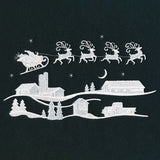 Santa's Flight Over a Snowy Village Scene (Whitework)