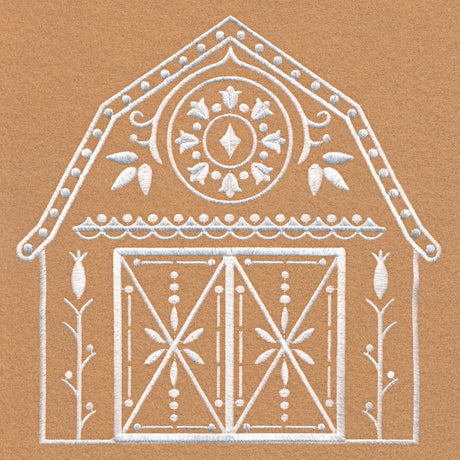 White embroidery of a barn with decorative patterns including a circular motif, dots along the roof, stylized flowers, and symmetrical doors on a brown fabric background.
