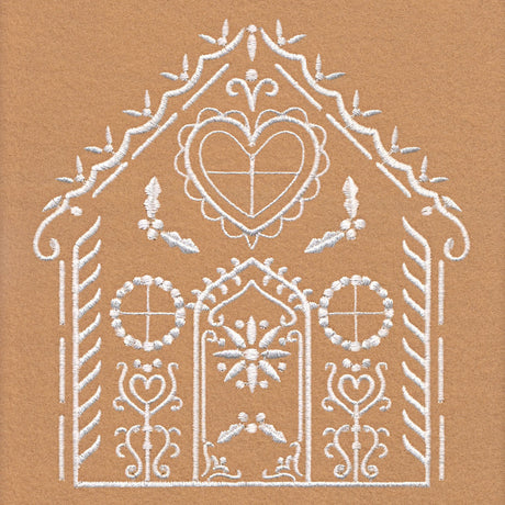 White embroidery of a house shape with a heart at the peak, circular window shapes, floral elements, and decorative borders on a tan fabric background.