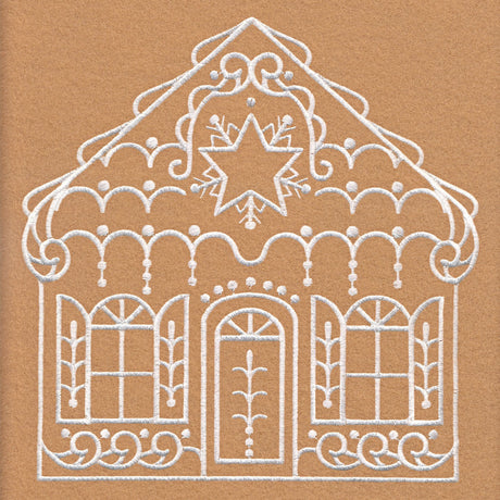 White embroidery of a gingerbread house with a star on the roof, arched windows with shutters, and a central door decorated with symmetrical flourishes on tan fabric.