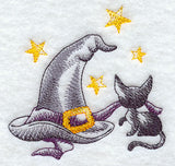 A Halloween Kitten with Witch's Hat and Stars