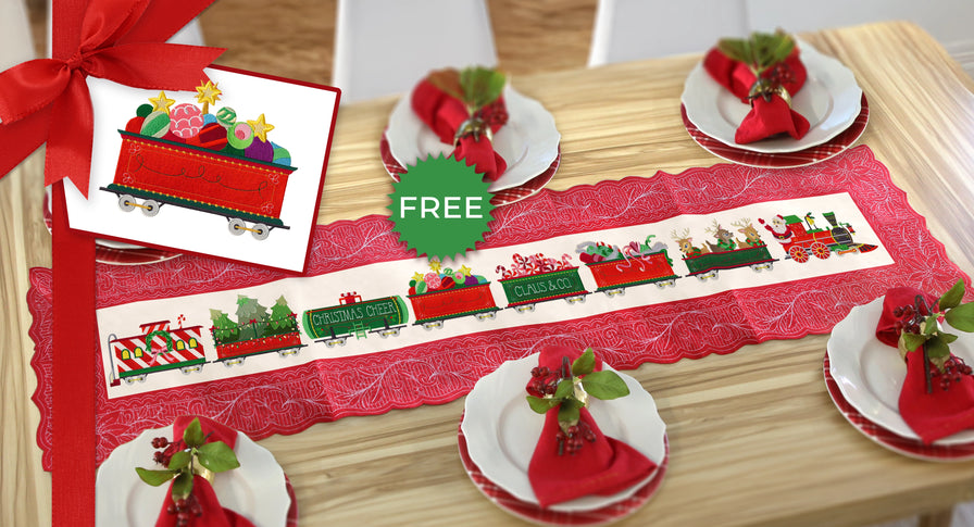 Christmas table setting with machine embroidery train on a table runner 