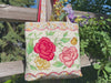 video featuring a machine embroidered tote bag project in different stages of completion.