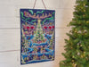 Video of staged machine embroidered advent calendar wall hanging being constructed and in use by various people.